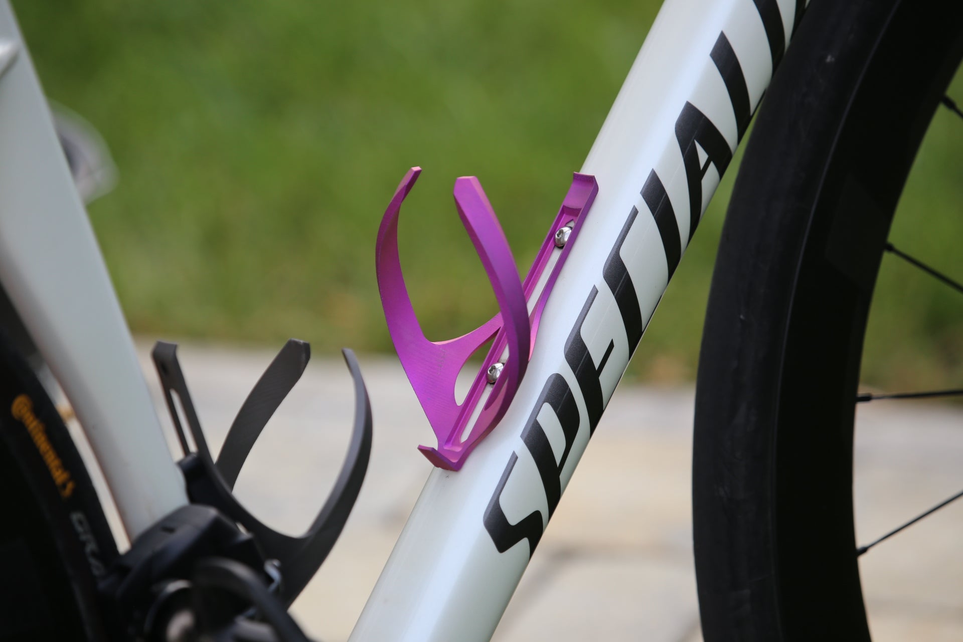 pink anodized bottle cage